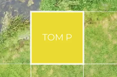 A grid square labelled “Tom P” highlighted in yellow